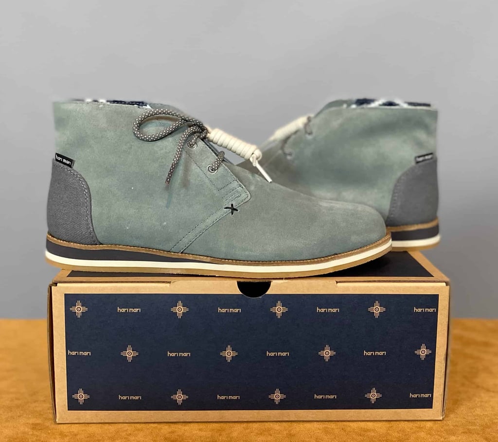 a pair of grey shoes on a box