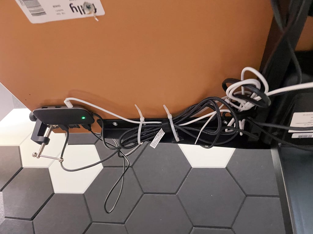 the usb-c dock that i mounted on the bottom of the jarvis standing desk