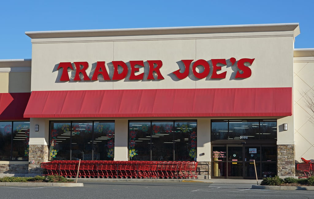 a store front with red awning