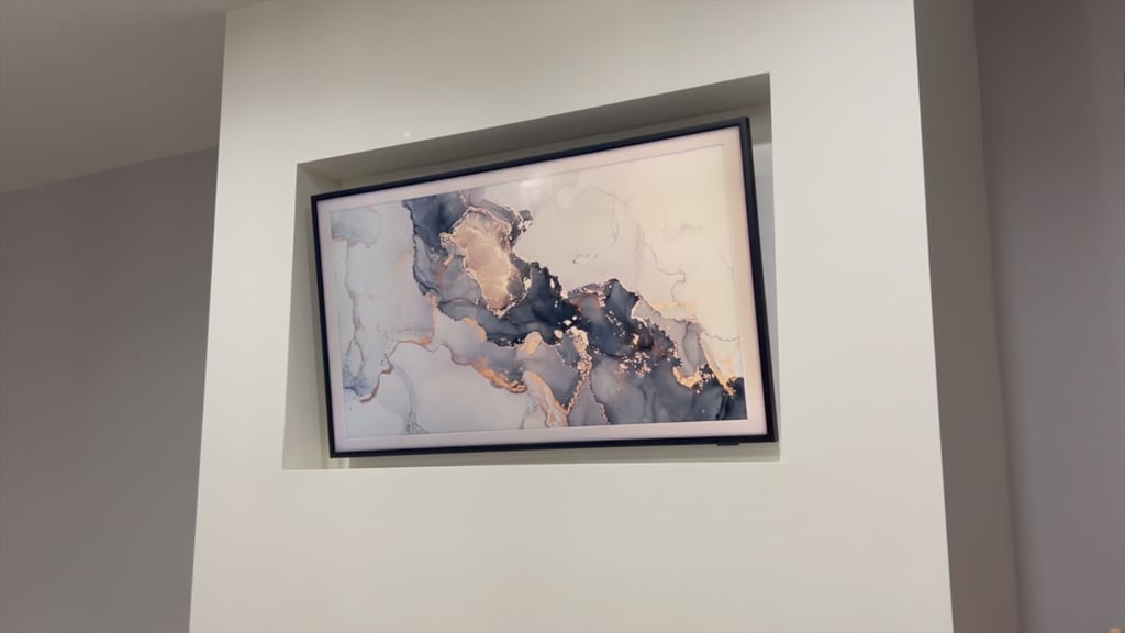 a framed painting on a wall