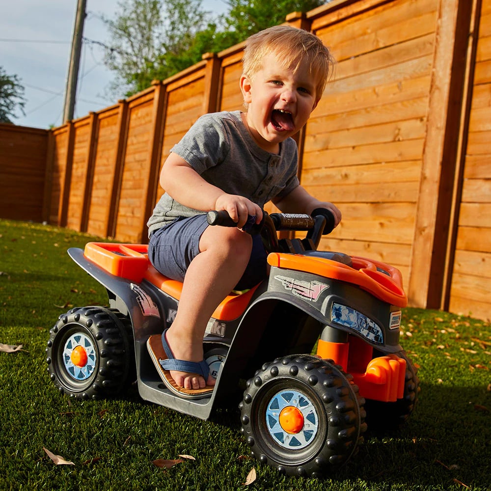 a child on a toy vehicle