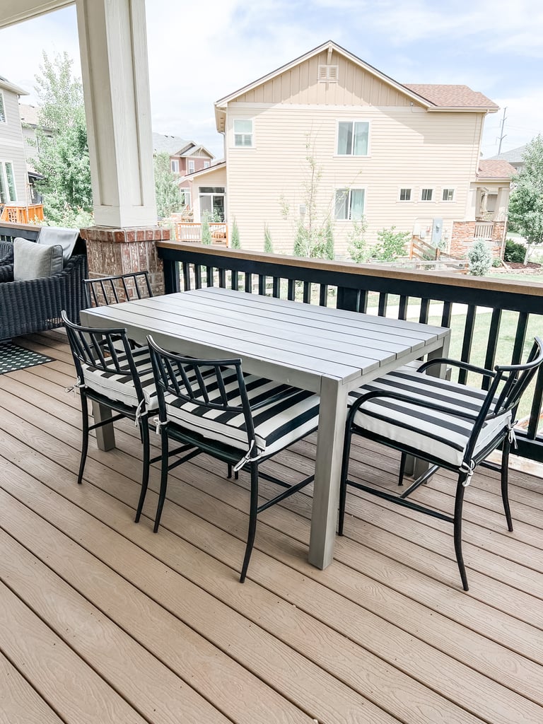 a table and chairs on a deck