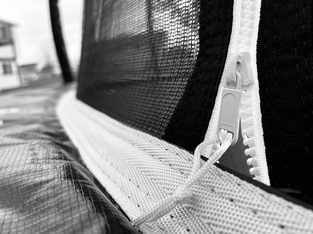 a close up of a zipper on a trampoline