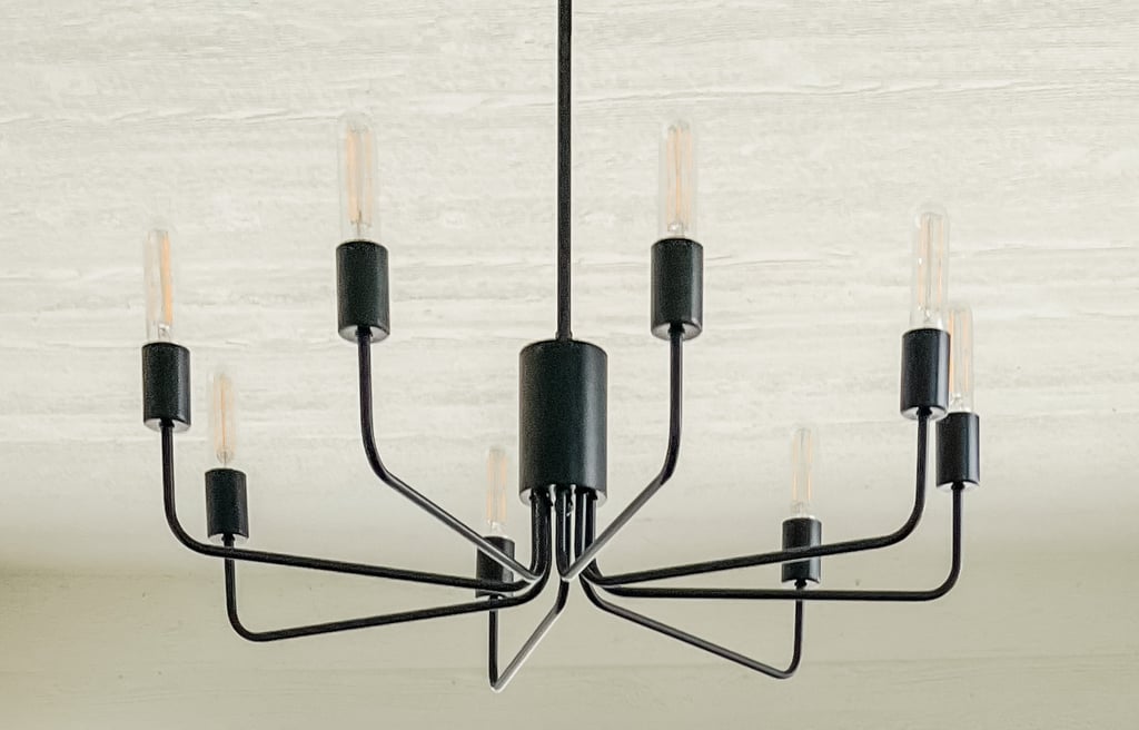 a black chandelier with light bulbs