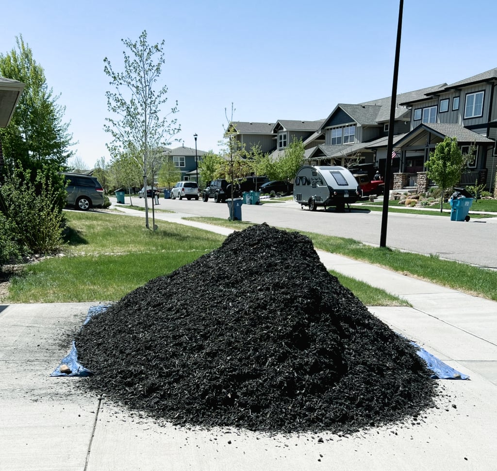 a pile of dirt on a sidewalk