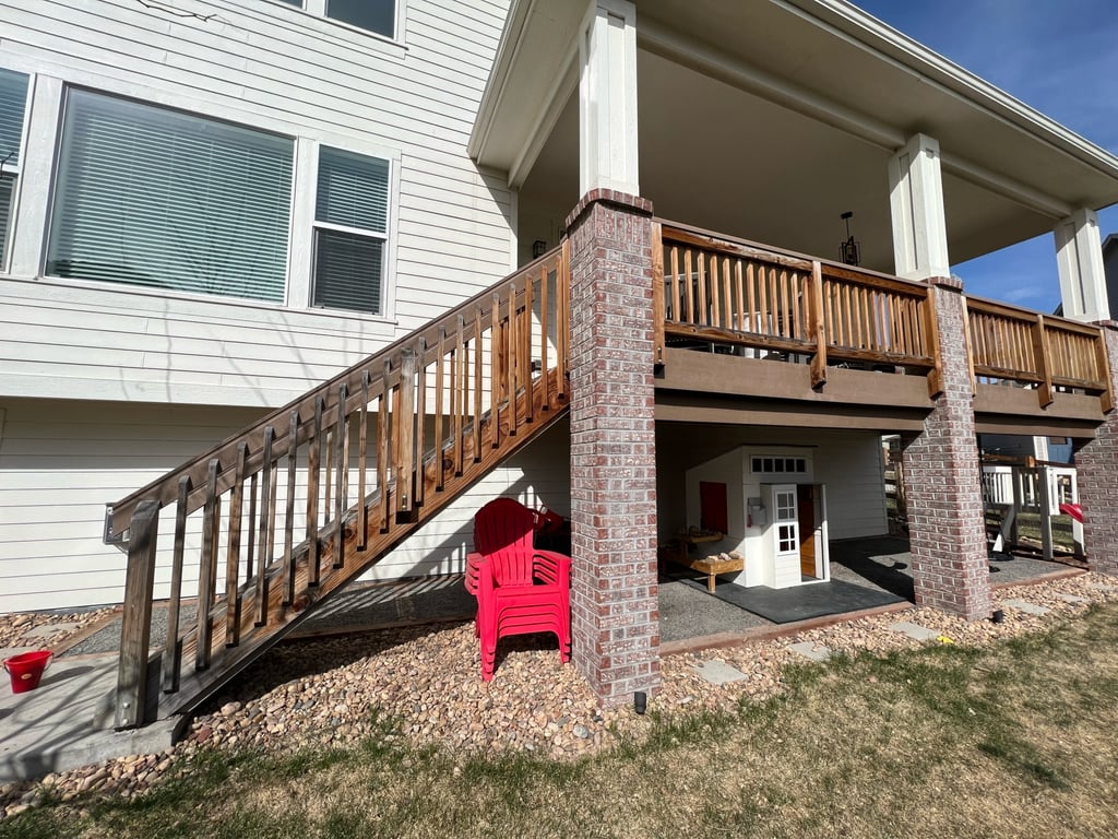 a house with a deck and stairs