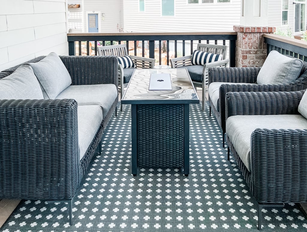 a patio with a table and chairs