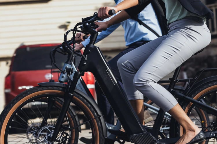 a group of people riding bicycles