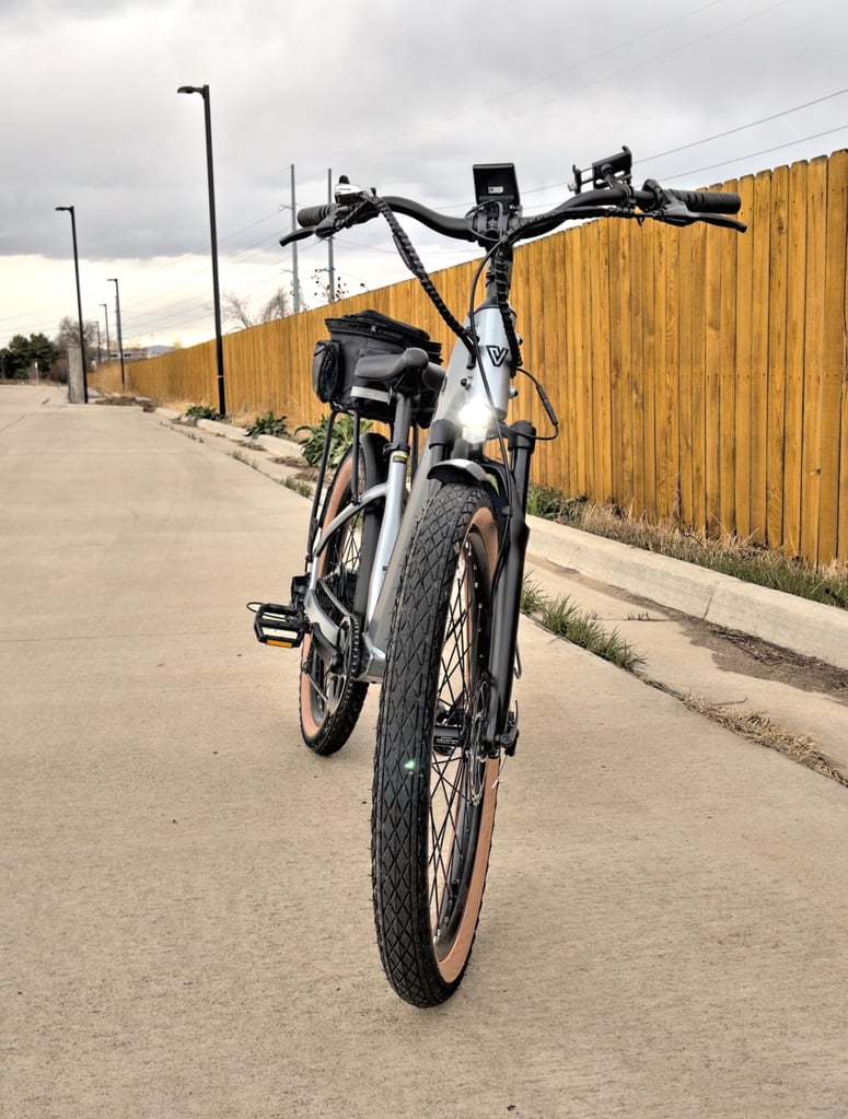 a bicycle parked on a sidewalk