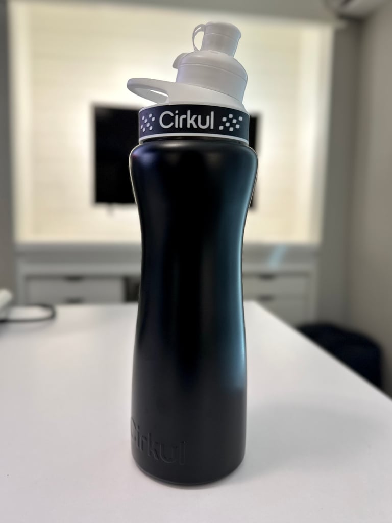the stainless steel black cirkul bottle looks great! inside? strawberry lemonade! our cirkul water bottle review? we love it!