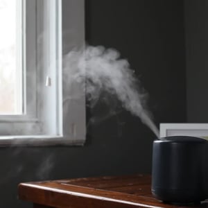 an ultrasonic diffuser is a device that utilizes vibrational frequencies to disperse essential oils into the air