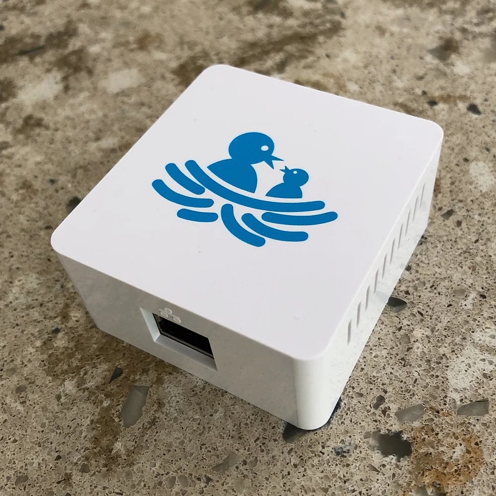 a white square object with a blue logo on it