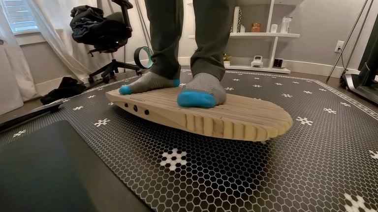 a person's feet on a wooden balance board