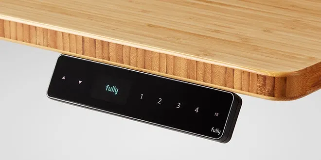 a black electronic device on a wooden surface