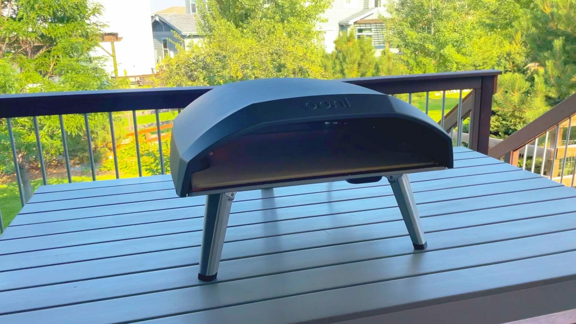 a black barbecue grill on a deck