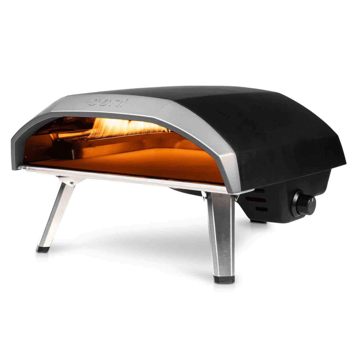 a black and silver outdoor oven with a yellow light