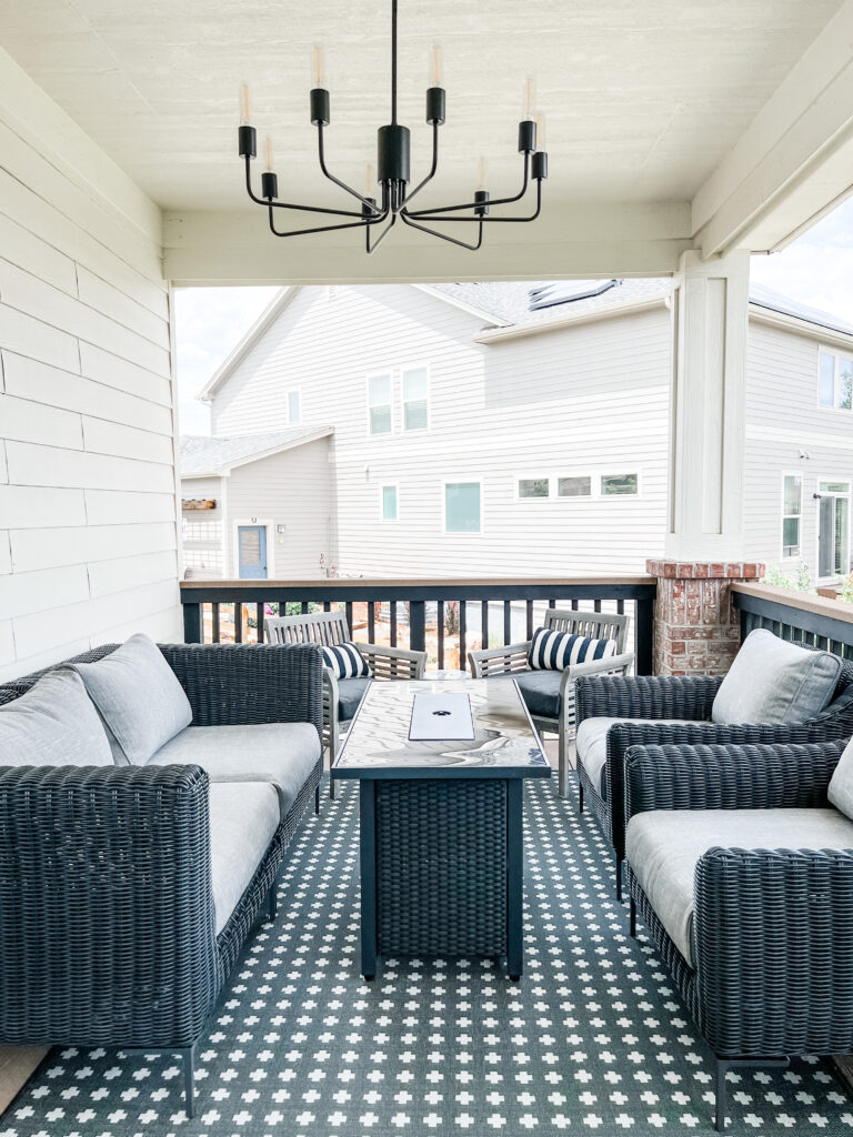 a patio with a table and chairs