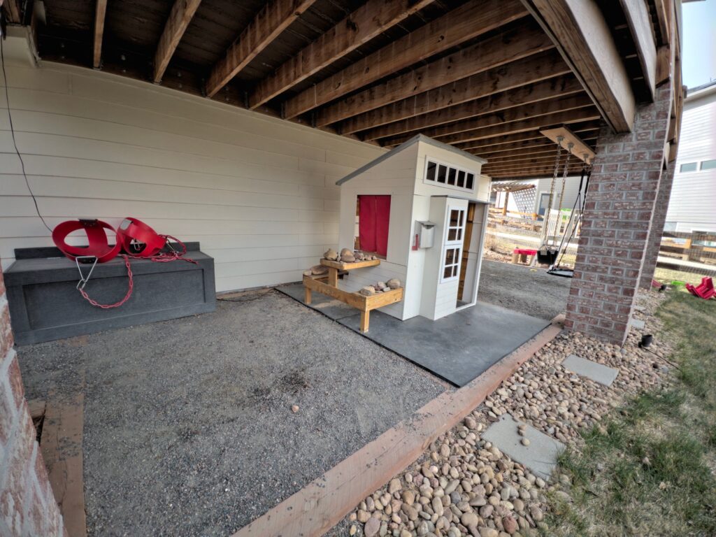 a small white and red playhouse